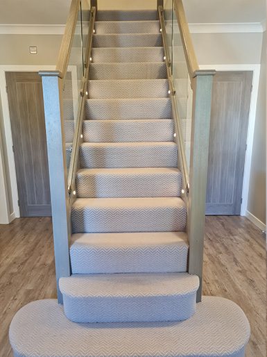 Existing staircase renovated with glass panels
